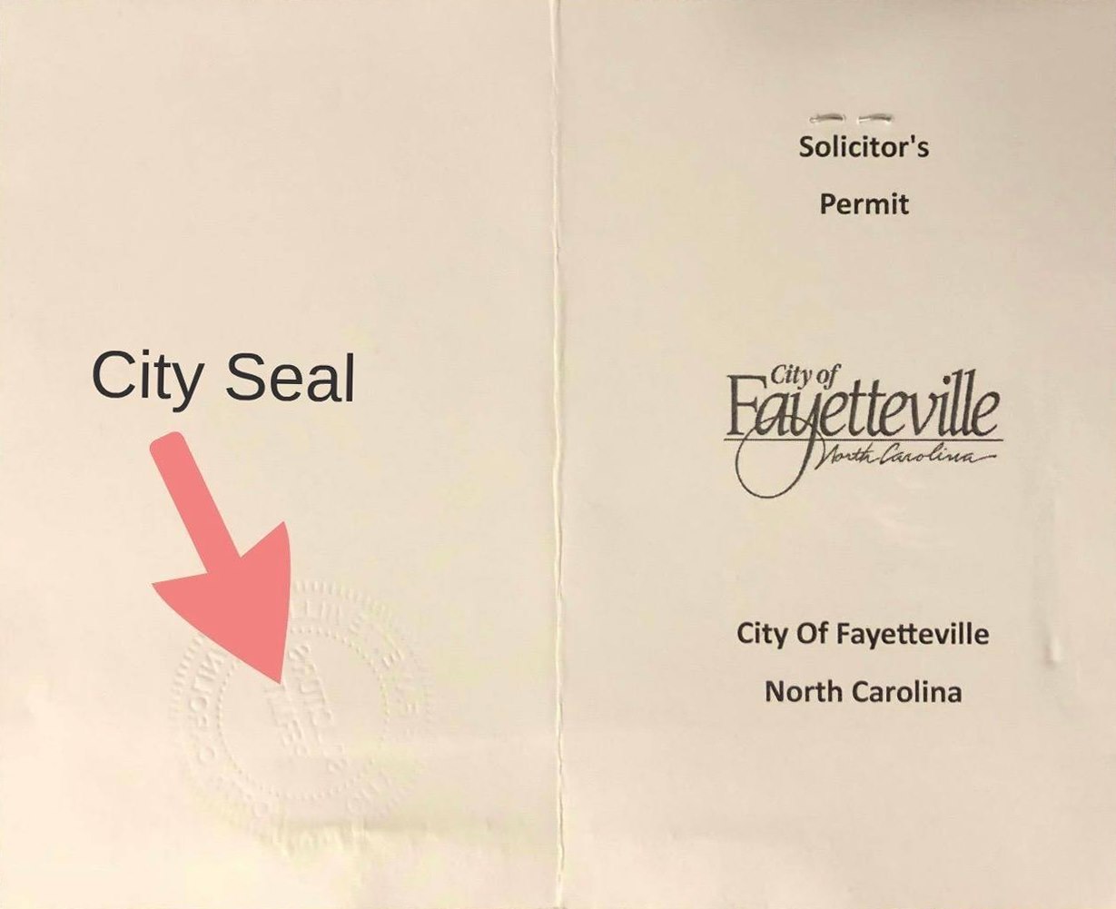 A city seal is shown on the back of a paper.